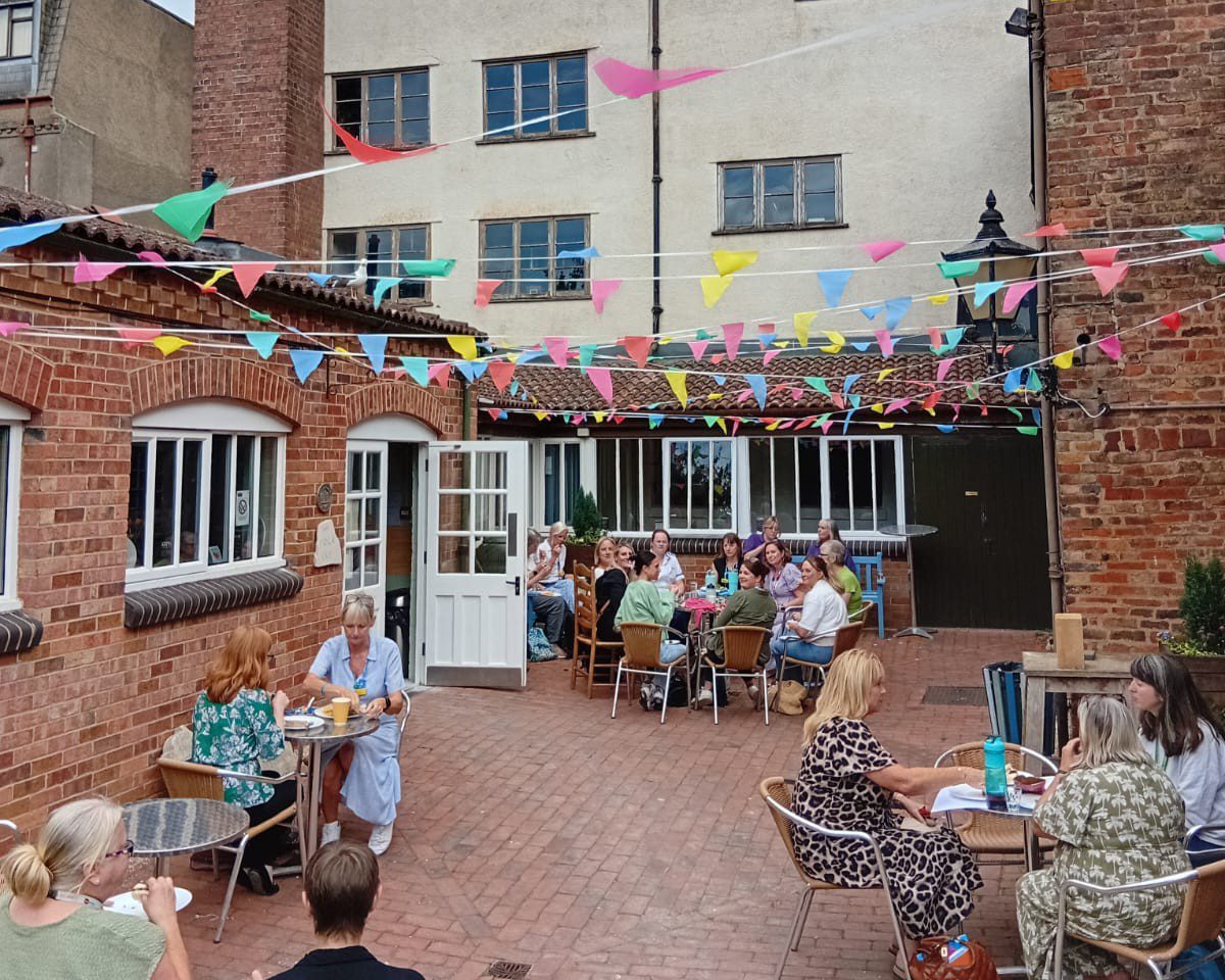 Event in Folk of Gloucester courtyard CROPPED © Jo Porlock Event in the Folk of Gloucester courtyard